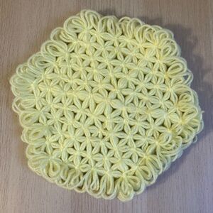 Vintage handmade trivet, knitted yarn, yellow, 70’s vibe
